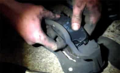 Mechanic installing brake pads
